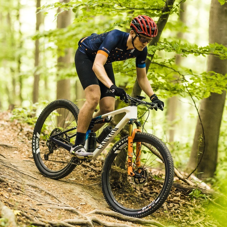 Oscar Huckle riding a Canyon Lux mountain bike